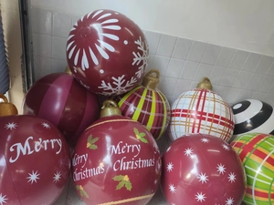 Detail view of large 60cm PVC Christmas balls with diverse snowflake and stripe patterns