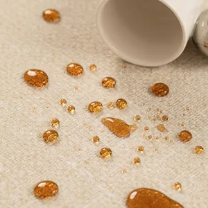 Waterproof stain-resistant beige woven carpet fabric with hydrophobic liquid droplets