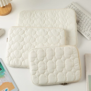 Three-piece set of cream white quilted cloud laptop sleeves in 11, 13, and 15 inch sizes