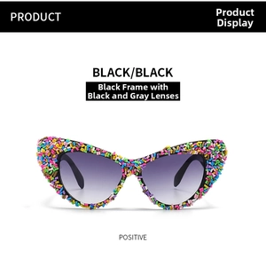 Detailed front view of black cat eye sunglasses with rainbow candy sprinkle frame edges