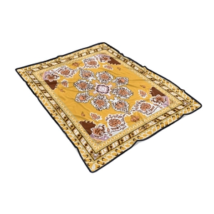 Detailed top view of a yellow bohemian flannel blanket with mandala patterns and black edging