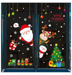 Detail of Christmas window stickers featuring Santa, reindeer, and a festive toy train