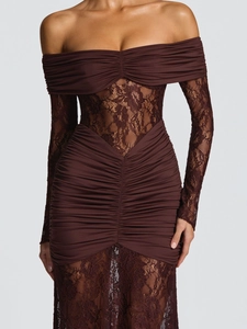 Close-up of ruched fabric and sheer lace floral patchwork on the long sleeve dress