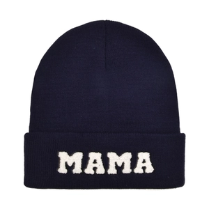 Detailed view of dark blue knit beanie with white MAMA embroidery and cuffed design