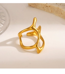 Close-up of a 18K gold irregular branch ring with organic lines and polished finish