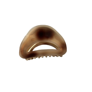 Brown tortoiseshell acetate hair claw clip with golden metal spring for women's hairstyle