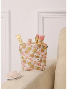Floral jacquard travel makeup bag with large capacity and woven texture for skincare storage