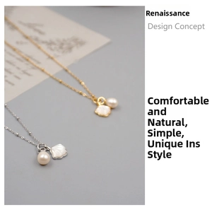 Detail of freshwater pearl necklace with shell pendant in gold and silver finishes