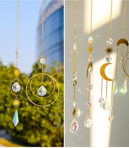 Detailed view of golden celestial suncatchers reflecting rainbow light through crystal prisms