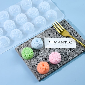 15-cavity flower silicone mold for baking and chocolate on a blue background