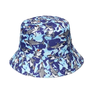 Tie-dye blue bucket hat featuring cartoon shark prints for sun protection and casual wear