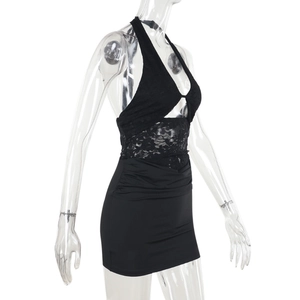 Detail of black halter lace dress showing cutout patchwork and bodycon silhouette