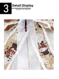Detail of burlap Christmas bow with snowman pattern and white faux fur trim decoration