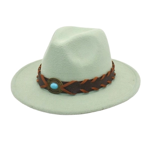 Detail of light green wool fedora with turquoise stone and brown leather band