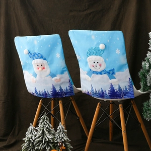 Blue Christmas chair covers with Santa and snowman patterns and festive light accents