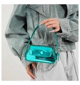 Detail of metallic green mini bag with glossy mirror finish and modern minimalist design