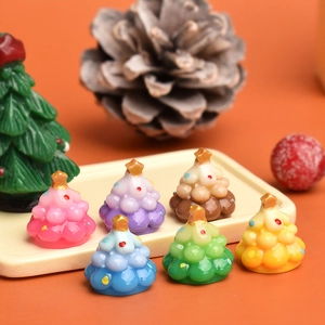 Miniature resin Christmas trees in pastel candy colors with gold star toppers for DIY crafts