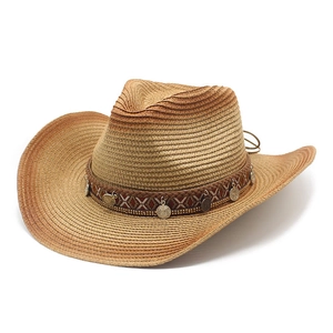 Macro detail of hand-woven straw cowboy hat with metallic coins and ethnic band