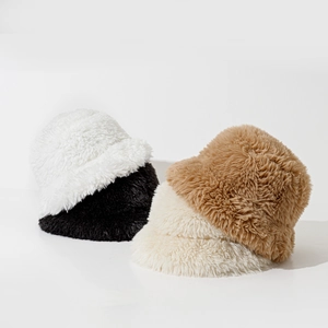 Detail showing plush winter bucket hats in white, black, beige and caramel brown fur