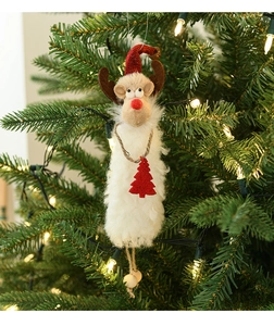 Detail of plush reindeer ornament with red hat and wooden beads on a Christmas tree