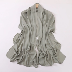 Detailed view of grey-green faux silk headscarf draped with soft folds and elegant sheen