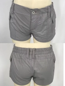 Front and back detail of grey washed denim shorts with textured fabric on a mannequin