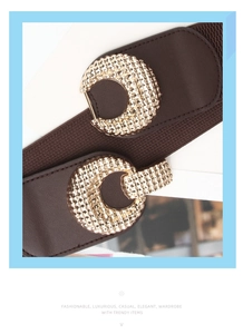 Close-up of brown elastic waist belts featuring textured round golden buckles