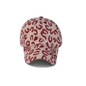 Detail of leopard print knitted baseball cap with warm texture and structured brim