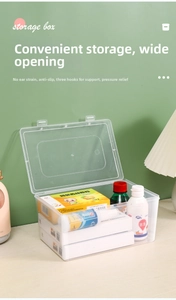 Transparent plastic storage box with lid for medicines and masks on a wooden desk