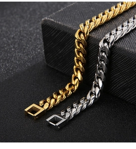 Close-up detail of polished and frosted Cuban link chains in gold and silver finishes