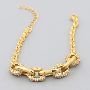 Detailed view of gold plated chain bracelet featuring pave set white zircon oval links