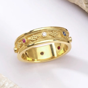 Vintage wide gold ring with colorful zircon stones and intricate relief texture