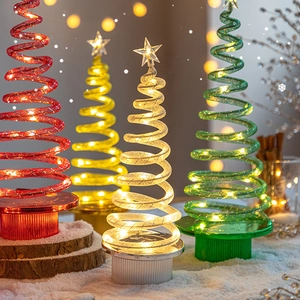 Set of four spiral LED Christmas trees in red yellow white and green with top stars