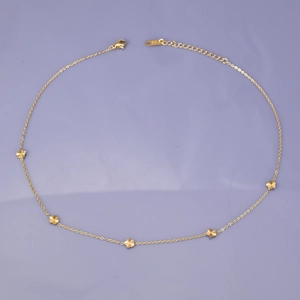Detail of 18K gold plated stainless steel necklace with five delicate flower pendants