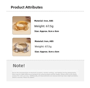 Detail view of gold and silver bohemian bangles with coin charms and metal texture
