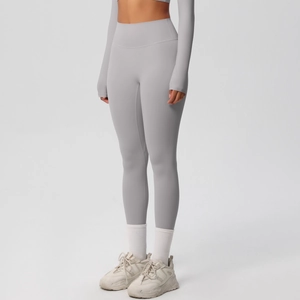 Detailed view of high-waist yoga pants in light grey with premium brushed fabric texture