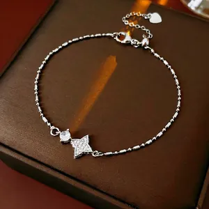 Minimalist star pendant bracelet with sparkling zircon on premium leather background