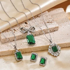 Elegant emerald green zircon jewelry set with square pendants and matching stud earrings