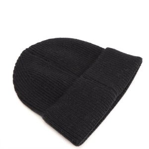 Close-up of black ribbed knit beanie showing texture and thick winter fabric quality