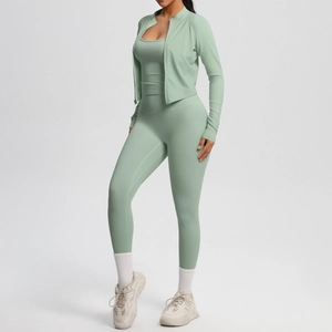 Detailed view of sage green yoga set featuring high-waisted leggings and zip jacket