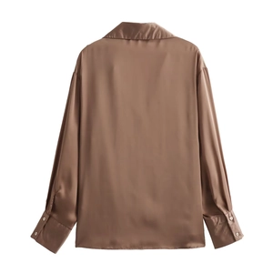 Detailed back view of a brown satin shirt with smooth texture and elegant drape