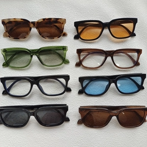 Collection of oversized cat eye sunglasses in various tortoiseshell and solid frame colors