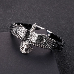 Men's punk leather bracelet featuring a silver eagle charm on a black braided strap