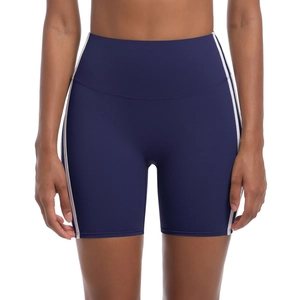 Detail view of high-waist navy yoga shorts with white side stripes and supportive waistband