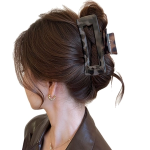 Large brown leopard print acrylic hair claw clip for thick hair shown on model