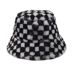 Detailed texture of black and grey checkered plush bucket hat in faux fur material