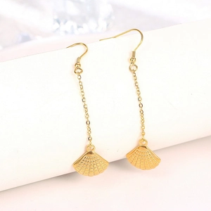 Elegant gold stainless steel tassel earrings with pearl shell pendant on white stand