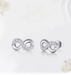 Macro shot of S925 sterling silver infinity earrings with sparkling zircon pave setting
