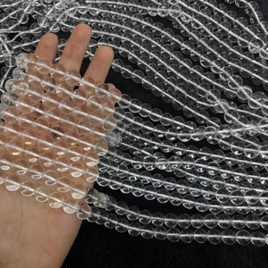 Close-up of high-transparency natural white crystal round beads in multiple strands