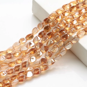 Detailed macro shot of amber faceted oval crystal beads for DIY jewelry and curtains